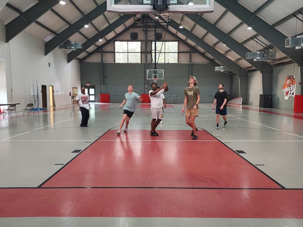 Teens playing basketball at SPORTSreach 180